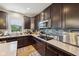 Bright kitchen with ample cabinet space, stainless steel appliances and stone backsplash at 8126 Kilborn Way, Avon, IN 46123