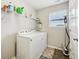 Laundry room with new washer and dryer and storage shelves at 8126 Kilborn Way, Avon, IN 46123