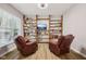 Cozy living room featuring built in shelves and two comfortable recliner chairs at 8126 Kilborn Way, Avon, IN 46123