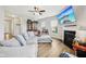 Comfortable living room featuring a fireplace, hardwood floors, and ample natural light, creating a welcoming atmosphere at 8126 Kilborn Way, Avon, IN 46123