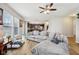 Bright and airy living room with hardwood floors, comfortable seating, and a view into the kitchen and dining area at 8126 Kilborn Way, Avon, IN 46123