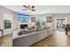 Cozy living room with hardwood floors, a fireplace, and large windows offering ample natural light at 8126 Kilborn Way, Avon, IN 46123