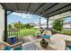 Outdoor patio area with cozy seating and a beautiful view of the backyard at 8126 Kilborn Way, Avon, IN 46123