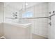 Bright, tiled shower stall featuring a glass enclosure, mosaic accents, and rainfall shower head at 8126 Kilborn Way, Avon, IN 46123