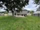 Spacious backyard with new concrete patio, wooden fence, and verdant lawn offers an outdoor living space at 8277 N Waterford Dr, Columbus, IN 47201