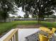 Spacious backyard featuring a concrete patio with yellow bistro set offers a welcoming outdoor space at 8277 N Waterford Dr, Columbus, IN 47201