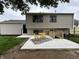 The backyard features a new concrete patio and basement access with a wooden railing for a touch of charm at 8277 N Waterford Dr, Columbus, IN 47201