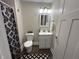 Well-lit bathroom featuring modern fixtures, a sleek vanity, and a decorative shower curtain at 8277 N Waterford Dr, Columbus, IN 47201