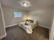 Bedroom featuring a plush bed with decorative pillows and blanket, alongside a tray with wine glasses at 8277 N Waterford Dr, Columbus, IN 47201