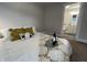 Bedroom featuring a plush bed with decorative pillows and blanket, alongside a bathroom view at 8277 N Waterford Dr, Columbus, IN 47201