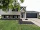 Charming two-story home with a well-manicured lawn and a two car garage at 8277 N Waterford Dr, Columbus, IN 47201