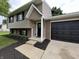 Charming two-story home with a well-manicured lawn and a two car garage at 8277 N Waterford Dr, Columbus, IN 47201