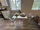 Bright eat-in kitchen featuring stainless steel appliances, white cabinets and countertops, and a charming dining area at 8277 N Waterford Dr, Columbus, IN 47201