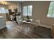 Bright eat-in kitchen featuring stainless steel appliances, white cabinets and countertops, and a charming dining area at 8277 N Waterford Dr, Columbus, IN 47201