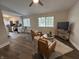 Open-concept living room featuring hardwood floors, modern furnishings, and natural light at 8277 N Waterford Dr, Columbus, IN 47201