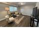 Basement living room featuring a comfortable couch, chair, rug, and a television at 8277 N Waterford Dr, Columbus, IN 47201