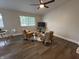 Open-concept living room featuring hardwood floors, modern furnishings, and natural light at 8277 N Waterford Dr, Columbus, IN 47201