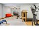 Finished basement recreational space with a home gym and seating area at 8301 Cooper Ln, Zionsville, IN 46077