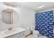Bathroom with a vanity with a vessel sink and a Colts themed shower curtain at 8301 Cooper Ln, Zionsville, IN 46077