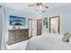 Bedroom featuring a mounted television, a spacious dresser, and an ensuite bathroom at 8301 Cooper Ln, Zionsville, IN 46077