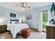 Horse themed bedroom features a plush bed, a comfortable leather ottoman, and bright lighting at 8301 Cooper Ln, Zionsville, IN 46077