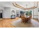 Elegant dining room features a wood table, decorative ceiling, and stylish lighting fixture at 8301 Cooper Ln, Zionsville, IN 46077