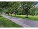 Tree-lined driveway leading to a beautiful home, showcasing the property's secluded setting at 8301 Cooper Ln, Zionsville, IN 46077