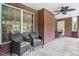 Covered porch with seating and a ceiling fan, perfect for enjoying the outdoors in comfort at 8301 Cooper Ln, Zionsville, IN 46077