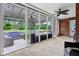 Screened-in porch with outdoor seating and a pergola, ideal for enjoying the views from indoors at 8301 Cooper Ln, Zionsville, IN 46077