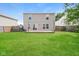 The backyard features a large, well-maintained lawn and wood deck at 8310 Becks Mill Ln, Indianapolis, IN 46113