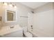 This bathroom has a tub and shower combination with a single sink vanity and neutral paint at 8310 Becks Mill Ln, Indianapolis, IN 46113