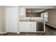 Clean kitchen with stainless steel appliances, white cabinetry, and a modern sink at 8310 Becks Mill Ln, Indianapolis, IN 46113