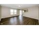 Spacious living area with dark wood flooring, lots of light, and an open layout at 8310 Becks Mill Ln, Indianapolis, IN 46113