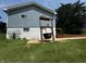 Backyard with a large cooking cauldron, a bench, and a well-maintained lawn at 8664 S Nash Dr, Nineveh, IN 46164