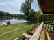 Backyard view from the elevated porch showing a beautiful lake with dock at 8664 S Nash Dr, Nineveh, IN 46164