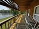 Inviting wood balcony features a porch swing and a great view of the lake at 8664 S Nash Dr, Nineveh, IN 46164