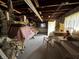 Unfinished basement with exposed ceiling, concrete floor, and items for storage along the walls at 8664 S Nash Dr, Nineveh, IN 46164