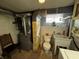 Functional bathroom with a sink, toilet, and a large window for natural light at 8664 S Nash Dr, Nineveh, IN 46164