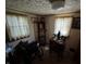 Bedroom featuring a desk and a display cabinet, with natural light coming in through two windows at 8664 S Nash Dr, Nineveh, IN 46164