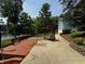 Deck with outdoor furniture and a swing looking out towards the water at 8664 S Nash Dr, Nineveh, IN 46164