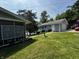Quaint blue home with well-manicured lawn, small garden, and a bird bath at 8664 S Nash Dr, Nineveh, IN 46164