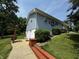 Charming two-story home with light blue siding, green lawn, and inviting walkway at 8664 S Nash Dr, Nineveh, IN 46164