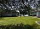 Well-maintained front yard showcasing a cozy cottage with a tranquil lake view at 8664 S Nash Dr, Nineveh, IN 46164