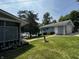 Charming blue cottage with a well-kept lawn and tranquil lake views at 8664 S Nash Dr, Nineveh, IN 46164