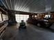 Spacious garage with ample storage, featuring a car and lawn mower; great for projects and parking at 8664 S Nash Dr, Nineveh, IN 46164