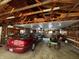 Well-equipped garage with high ceilings, offering space for vehicle parking, projects, and storage solutions at 8664 S Nash Dr, Nineveh, IN 46164