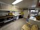 Spacious laundry room featuring ample storage cabinets and counter space, washer and dryer hookups at 8664 S Nash Dr, Nineveh, IN 46164