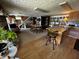 Open-concept living room features a large island with bar stool seating, plus a living space with a staircase at 8664 S Nash Dr, Nineveh, IN 46164
