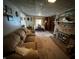 Cozy living room with a brick fireplace and comfortable seating at 8664 S Nash Dr, Nineveh, IN 46164