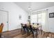 Bright dining room with natural light, modern decor, and hardwood floors at 8753 Champions Dr, Indianapolis, IN 46256